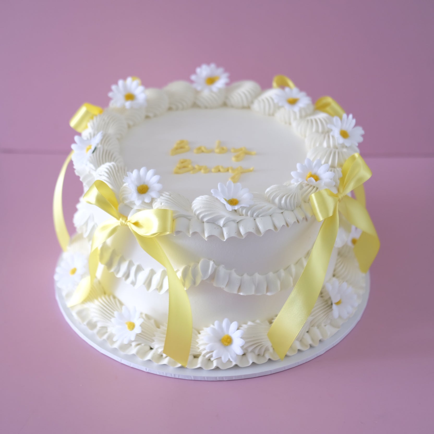 Vintage Round Cake Coquette Daisy - white shell piping with daisy blooms and yellow bows Brisbane